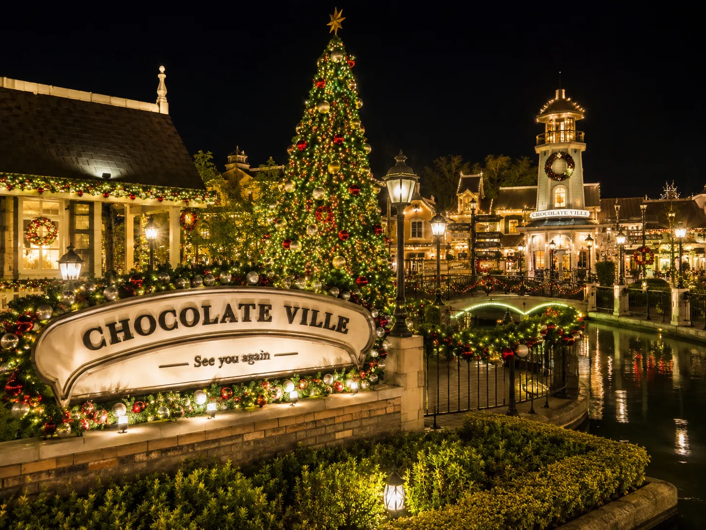 Chocolate Ville Bangkok no Natal Chocolate Ville em Bangkok decorado para o Natal com árvore iluminada, luzes festivas e canal refletindo as decorações